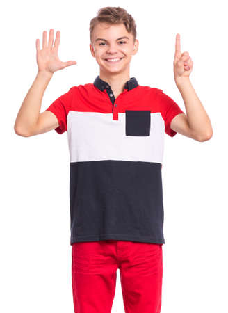 Portrait of happy teen boy showing two palms - 6 fingers, isolated on white background. Happy smiling child doing gesture of number Six. Series of photos count from 1 to 10.の写真素材