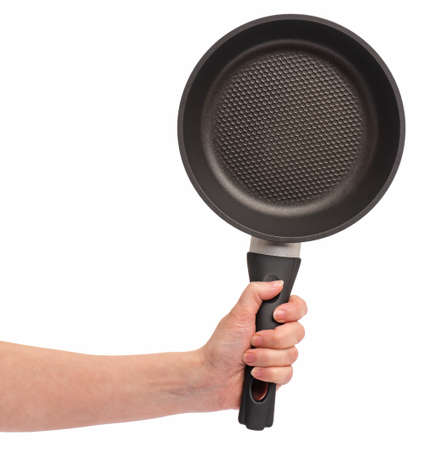 Female hand holding simple new empty Non-stick Frying Pan with black handle, isolated on white background.の写真素材