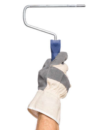 Close up view of Worker Man Hand with Paint Roller Brush. Male Hand wearing Working Glove with Tools. Human hand holding new Roller, isolated on white background.の写真素材