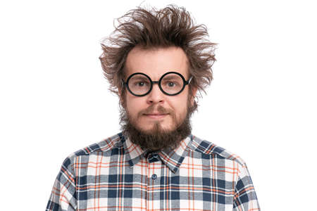 Crazy Bearded Man in Eyeglasses, isolated on white background. Happy Guy in plaid shirt with funny Haircut, smiling and looking at camera. Emotions and signs conceptの写真素材