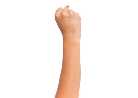 Female hand with fingers folded into fist, isolated on white background. Beautiful hand of woman with copy space.の写真素材
