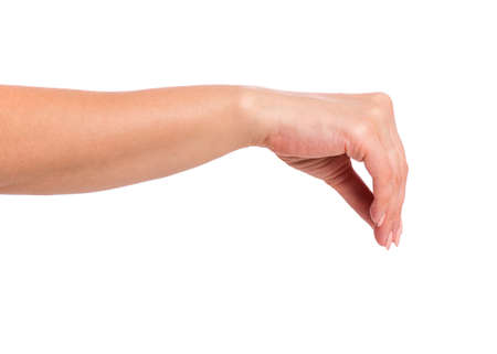 Female hand holding something, isolated on white background. Beautiful hand of woman with copy space.の写真素材
