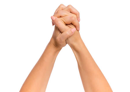 Female hand with fingers folded into fists, isolated on white background. Beautiful hand of woman with copy space, winning gesture.の写真素材