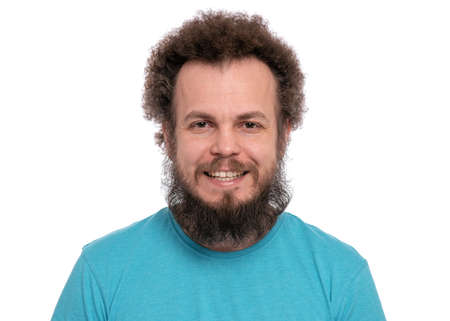 Happy crazy bearded Man with funny Curly Hair, isolated on white background. Looking at camera and smiling. Emotions and signs concept.の写真素材