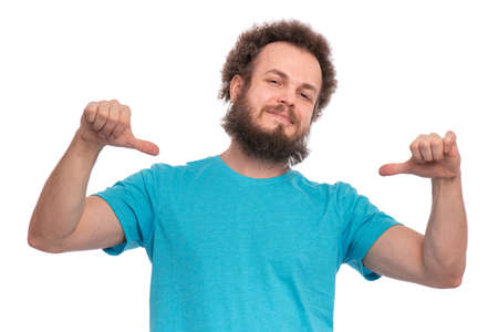 Handsome Crazy bearded Man with funny Curly Hair looking Confident with Smile on face, pointing oneself, isolated on white background. Looking at camera. Emotions and signs concept.の写真素材