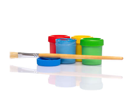 Set of Colorful Gouache jars and artist brushes isolated on white background with copy space. Cans of different colors gouache paints.の写真素材