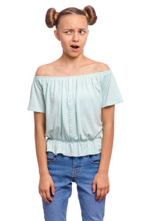 Portrait of surprised teen girl, isolated on white background. Funny child looking at camera in amazement. Beautiful caucasian teenager, opening mouth with shock and looking away.の写真素材
