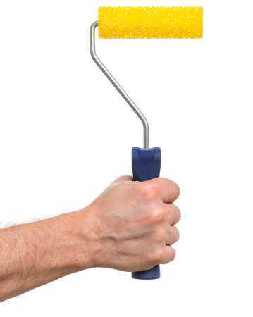 Close up view of Worker Man Hand with Paint Roller Brush. Human hand holding new Roller, isolated on white background. Male Hand with Tools.の写真素材