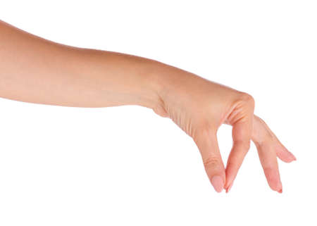 Female hand holding something, isolated on white background. Beautiful hand of woman with copy space.の写真素材