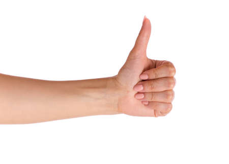Female hand showing Thumb up gesture, isolated on white background. Beautiful hand of woman with copy space.の写真素材