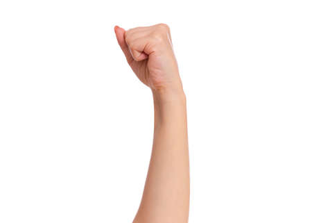 Female hand with fingers folded into fist, isolated on white background. Beautiful hand of woman with copy space.の写真素材