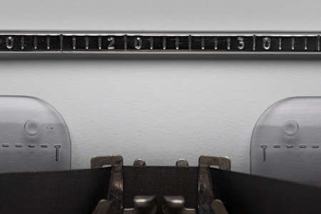 Closeup vintage manual typewriter with empty white paper for typing text.の写真素材