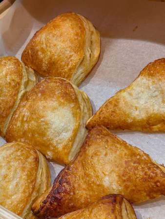 Cake shop with sweets pastry puffs on showcase table, close-upの写真素材