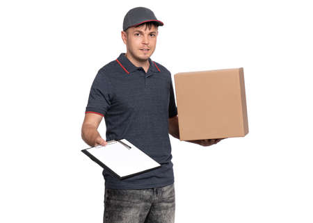 Delivery man with parcel box. Courier with clipboard and cardboard box isolated on white background. Space for text.の写真素材