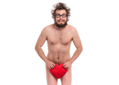 Happy Valentines Day. Bearded Man in eye Glasses. Happy and silly guy in Love, isolated on white. Cheerful naked man with Red plush Heart.の写真素材