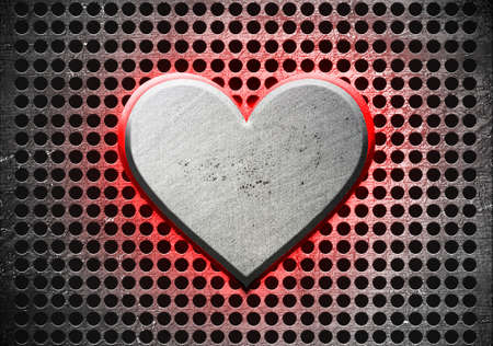 Metal heart on a metal backgroundの写真素材