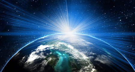 blue earth in space with rising sunの写真素材