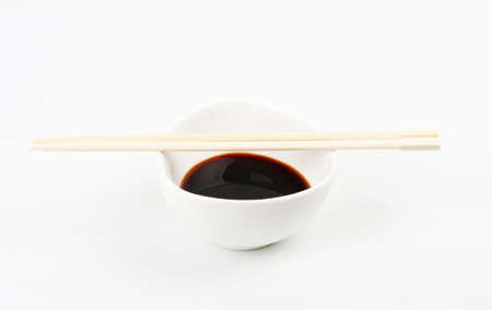 Soy Sauce in Suace-boat. Isolated over Whiteの写真素材