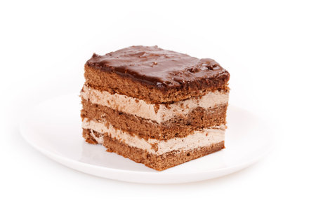 A slice of chocolate cake isolated on whiteの写真素材