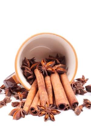 cinnamon in cofee cup isolated on white