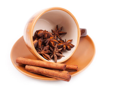 cinnamon in cofee cup isolated on whiteの写真素材