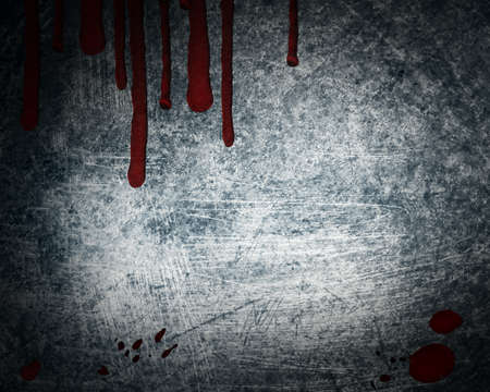 steel background with drop of bloodの写真素材