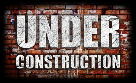 Under Construction on brick wall