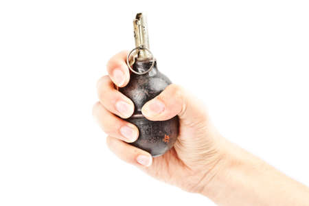 old hand grenade in a man's handの写真素材