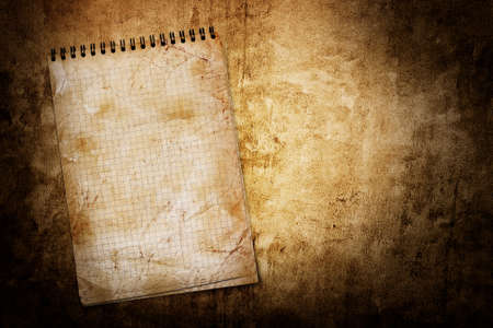 old used notebook on grunge backgroundの写真素材