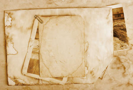 Vintage background with old paper, letters and photosの写真素材