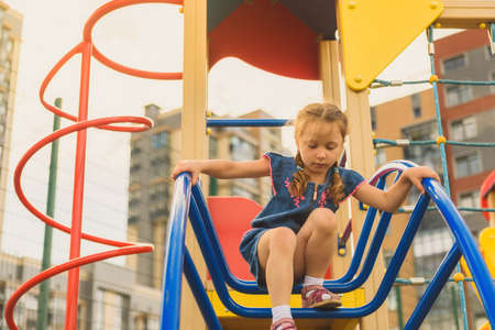 Active little girl on playgroundの写真素材