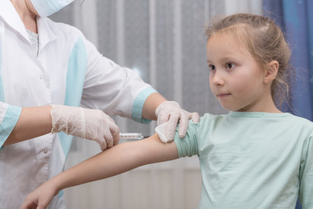 A doctor makes a vaccination to a childの写真素材