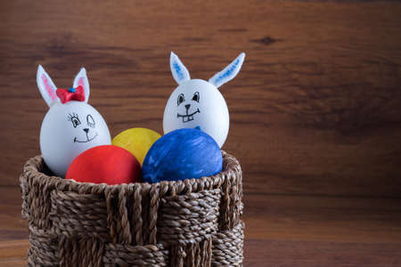 Cute creative photo with easter eggs, some eggs as the Easter Bunnyの写真素材