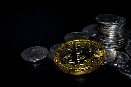 gold coin bitcoin on black background