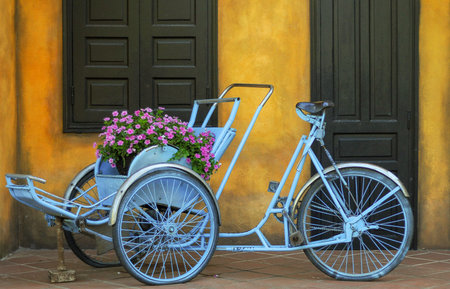 yellow wall blue rickshaw