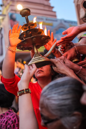 Rishikesh, India - March, 23, 2015. Ganga Aarti ceremony in Parmarth Niketan ashram at sunset. Rishikesh is World Capital of Yoga, has numerous yoga centersのeditorial素材