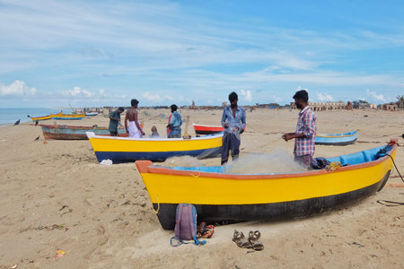 Rameshwaram, India - November, 21st, 2017. Fishermen with their boats on the beach near a small village Dhanushkodiのeditorial素材