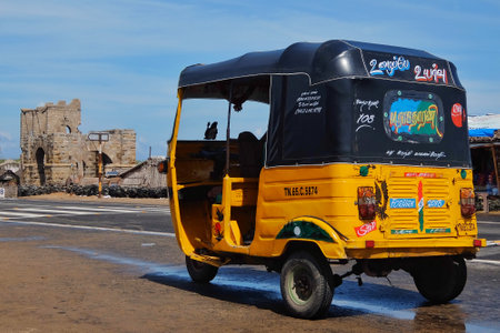 Rameshwaram, India - November, 21st, 2017. Autorickshaw waiting for passengers near small fishermen's village Dhanushkodi. Abandoned railway in background.のeditorial素材