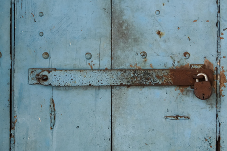 Old door with rusty lockの写真素材