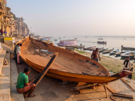 Varanasi, India - December, 9th, 2017. Boats on the ghats of Varanasi.のeditorial素材