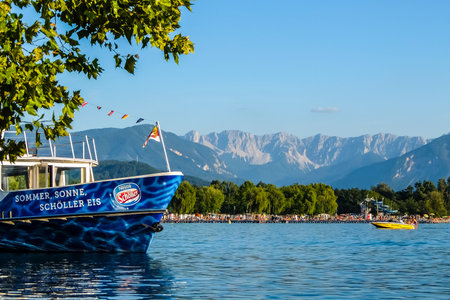 Klagenfurt, Austria - August, 18th, 2017. View of Worth lake with mountains and clear blue sky in background.のeditorial素材