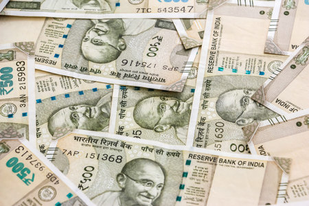 Close up view of brand new indian 500 rupees banknotes. Colorful money background.
