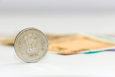 Close up view of brand new indian 10, 50, 100, 200, 500 and 2000 rupees banknotes and coin.