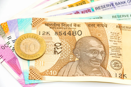 Close up view of brand new indian 10, 50, 100, 200, 500 and 2000 rupees banknotes and coin.