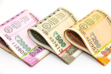 Close up view of brand new indian 200, 500 and 2000 rupees banknotes on white background.