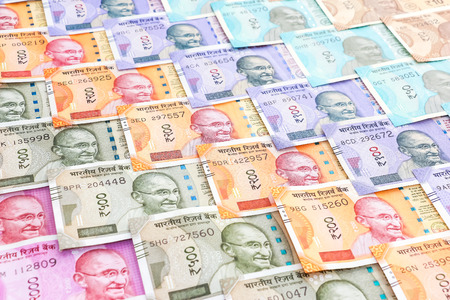 Close up view of brand new indian 10, 50, 100, 200, 500 and 2000 rupees banknotes. Colorful cash money pattern background.の写真素材