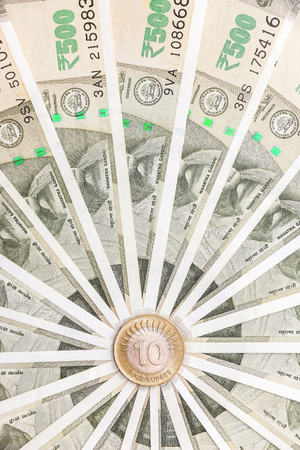Close up view of brand new indian 500 rupees banknotes and coin.の写真素材