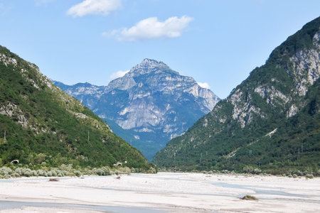 View of the dry river Fella. Sunny day in italian mountains.の写真素材