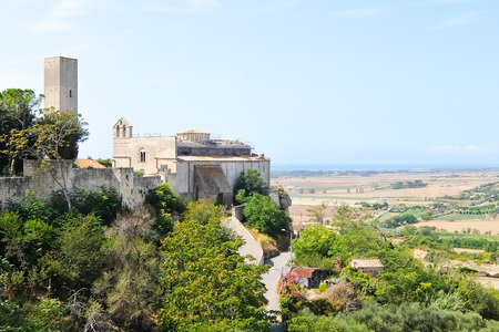 Tarquinia, Italy - Circa September 2017. Sunny day in Tarquinia. Beautiful view of catholic church (Chiesa di Santa Maria in Castello ). XI century.の写真素材