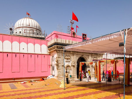 Deshnok, India - Circa March 2018. Devotees visit famous Karni Mata Temple.
